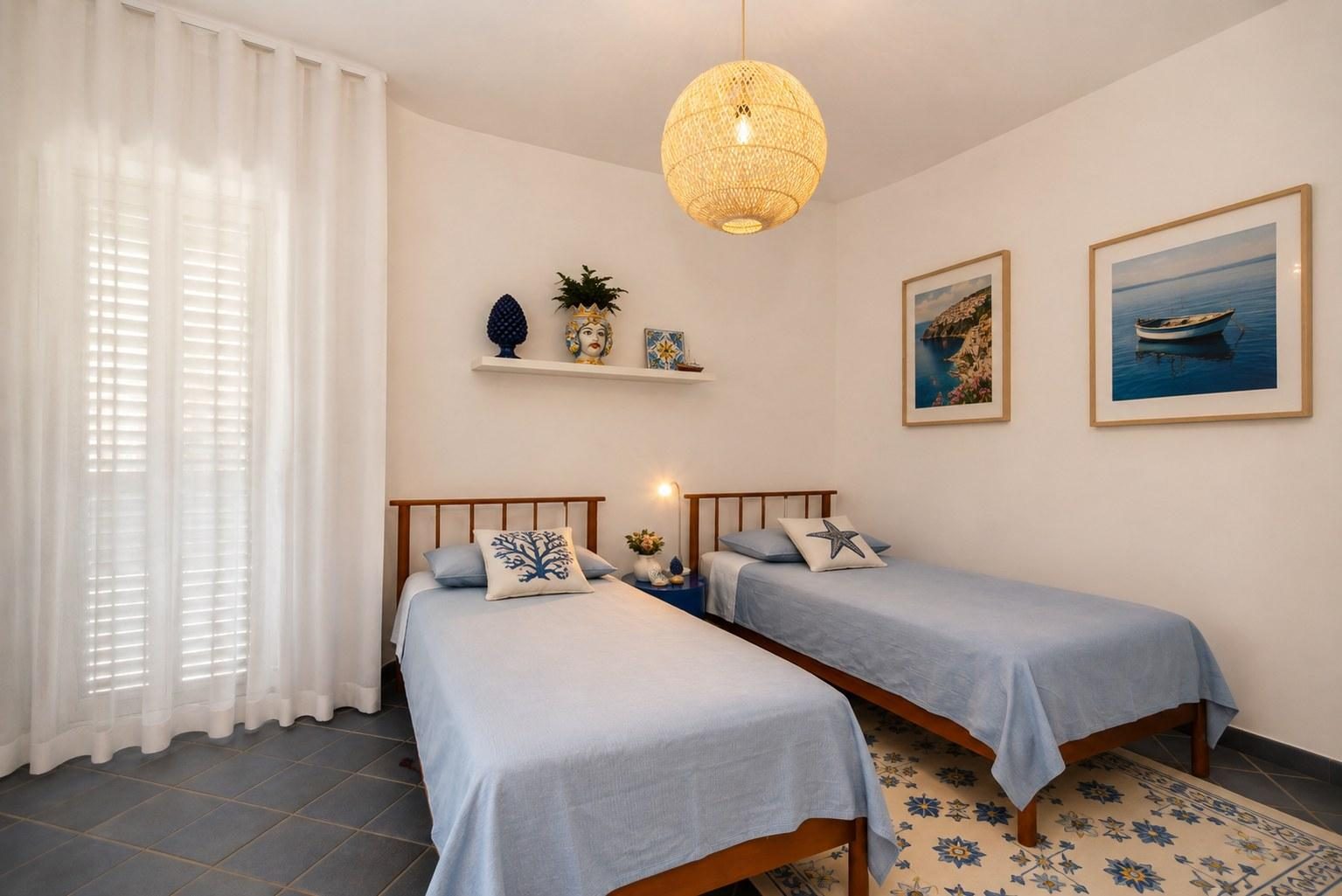 Twin beds with sheer curtains