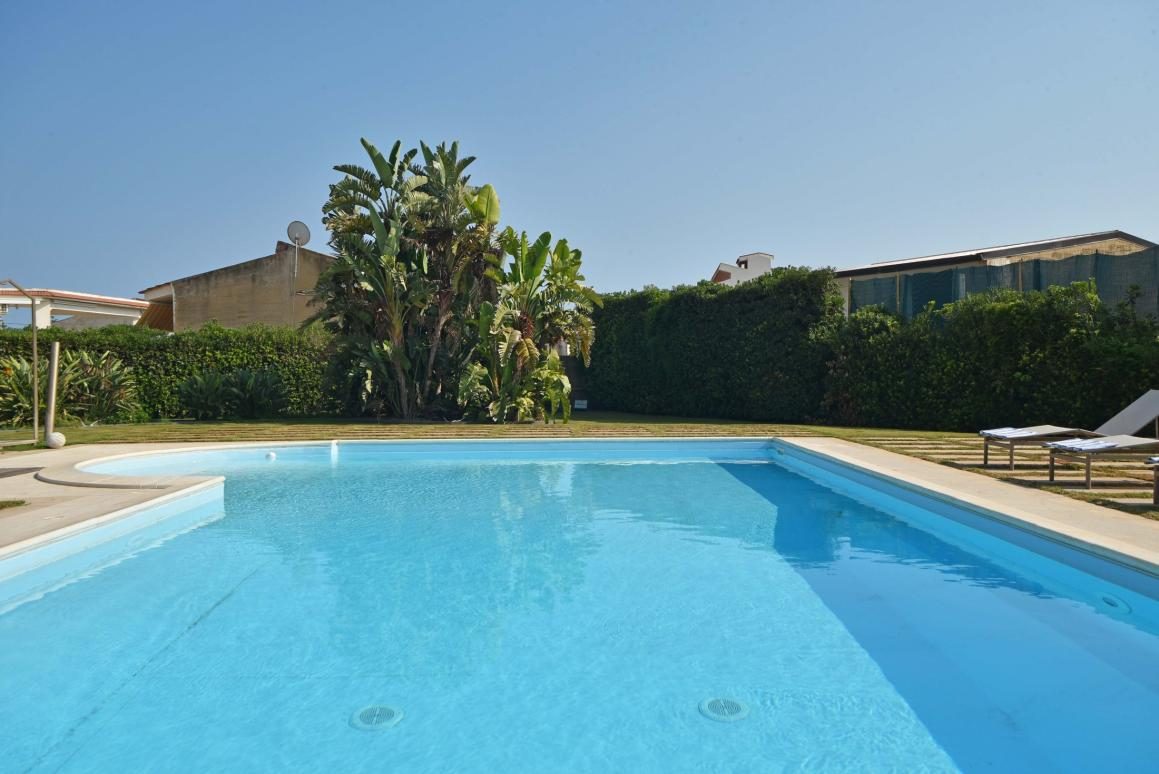 Private pool with lawn