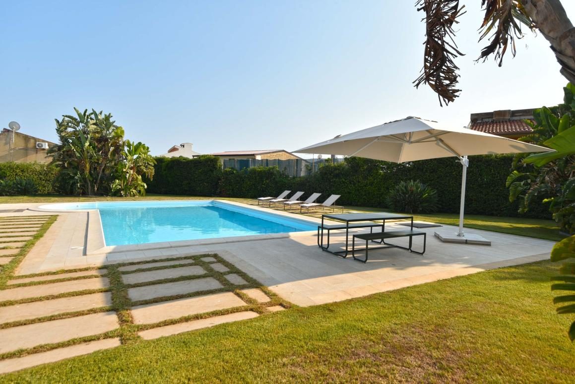 Pool sun terrace with umbrella